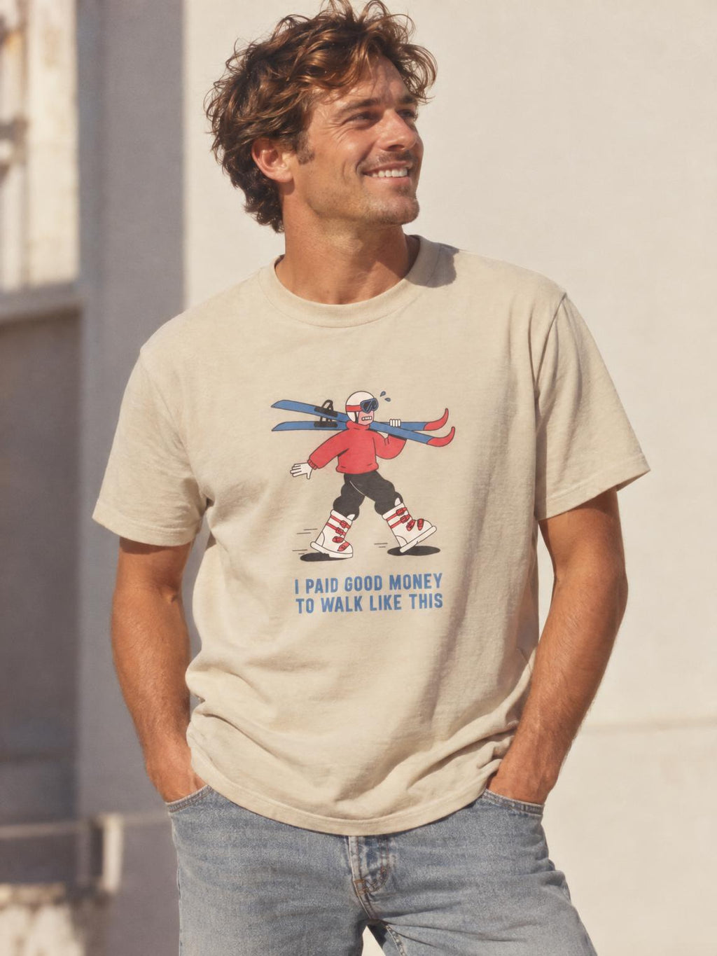 Skiing I Paid Good Money To Walk Like This Funny Ski T-Shirt in Sand – worn by a man