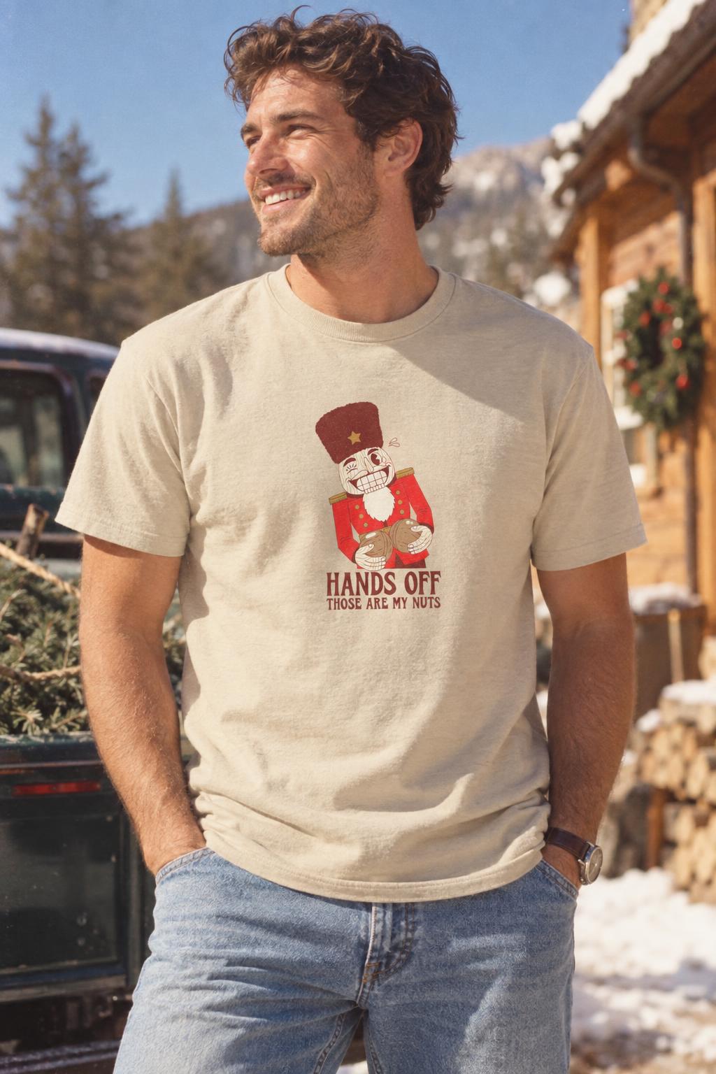 Funny Christmas Nutcracker Hands Off My Nuts T-Shirt in Sand – worn by a man
