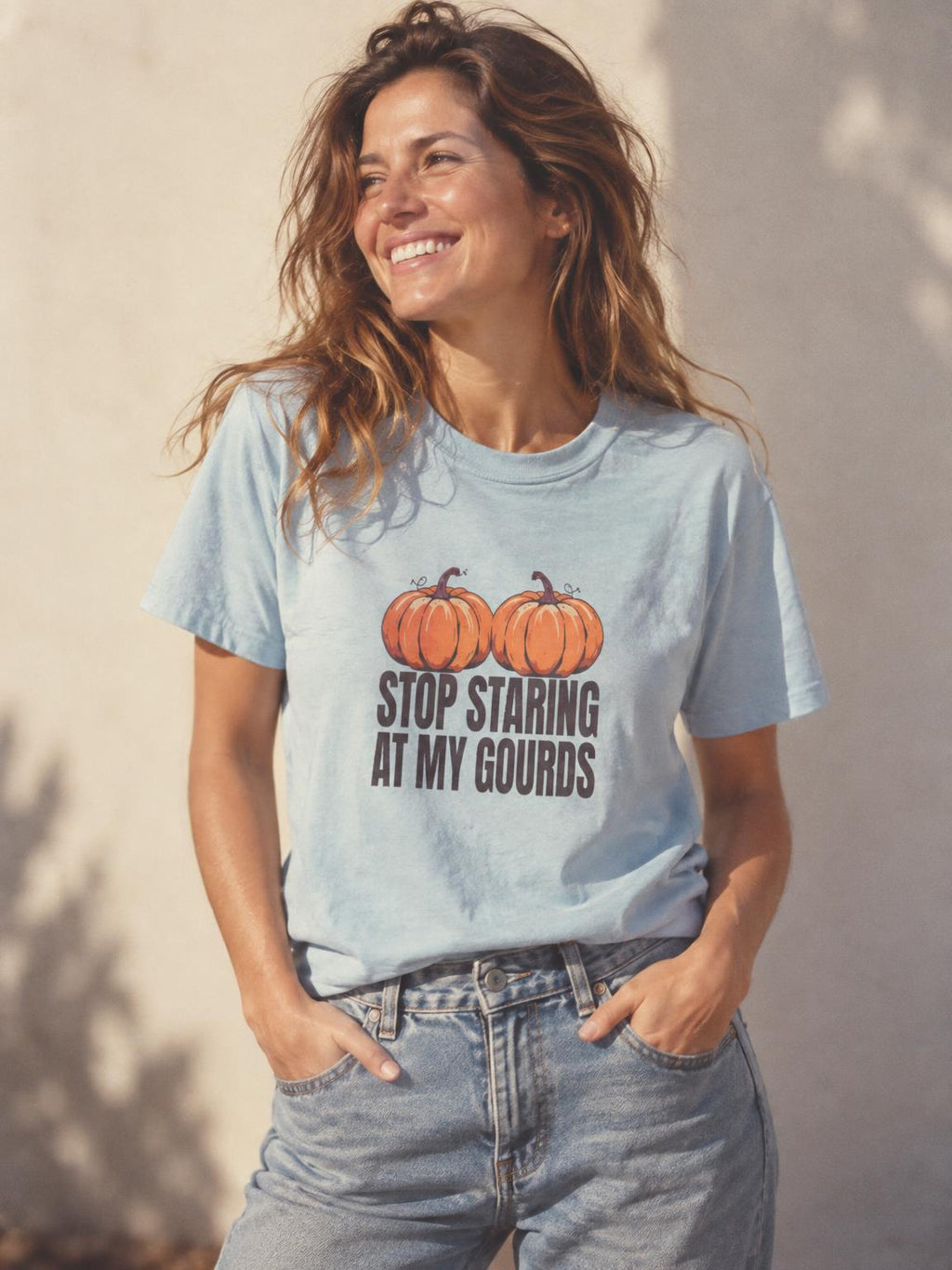 Stop Staring At My Gourds Funny Halloween Pumpkin T-Shirt in Light Blue – worn by a woman