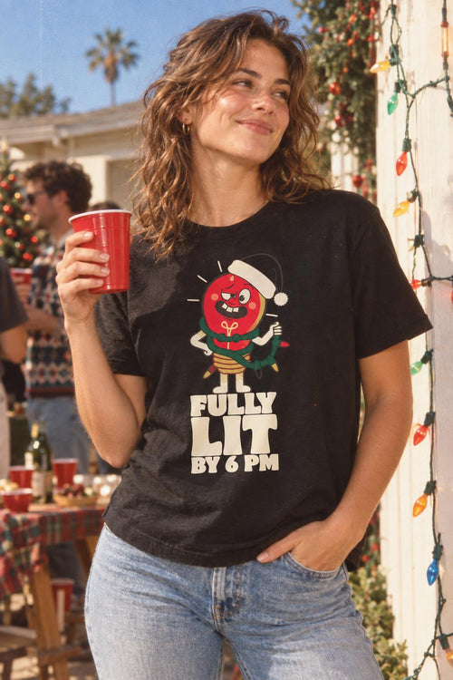 Fully Lit By 6 PM Funny Christmas Party T-Shirt in Black – worn by a woman