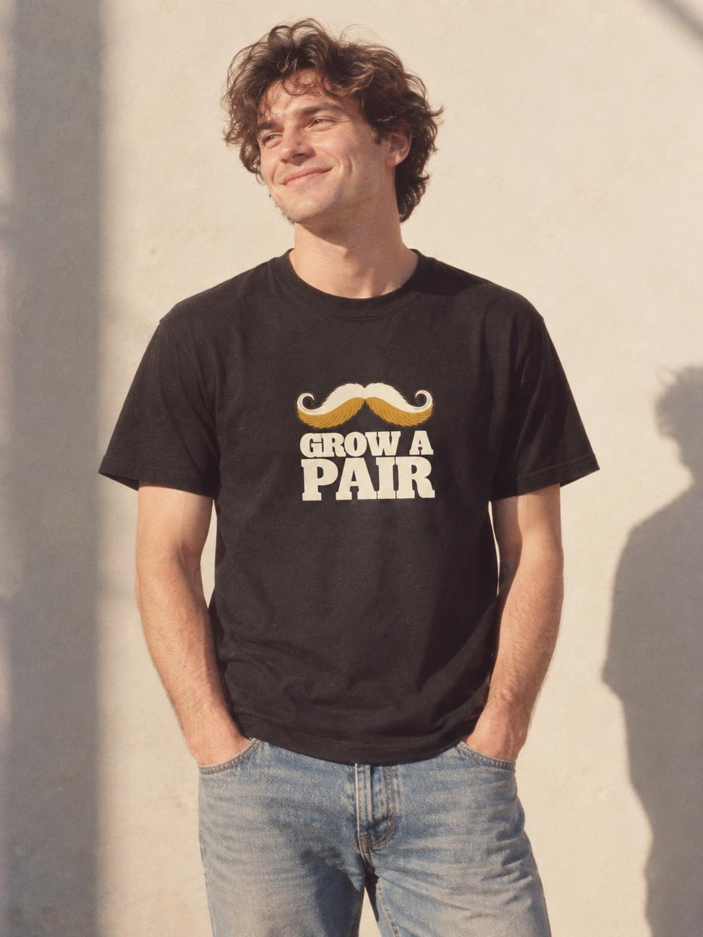 Mustache T-Shirt Grow A Pair Funny Handlebar Moustache T-Shirt in Black – worn by a man