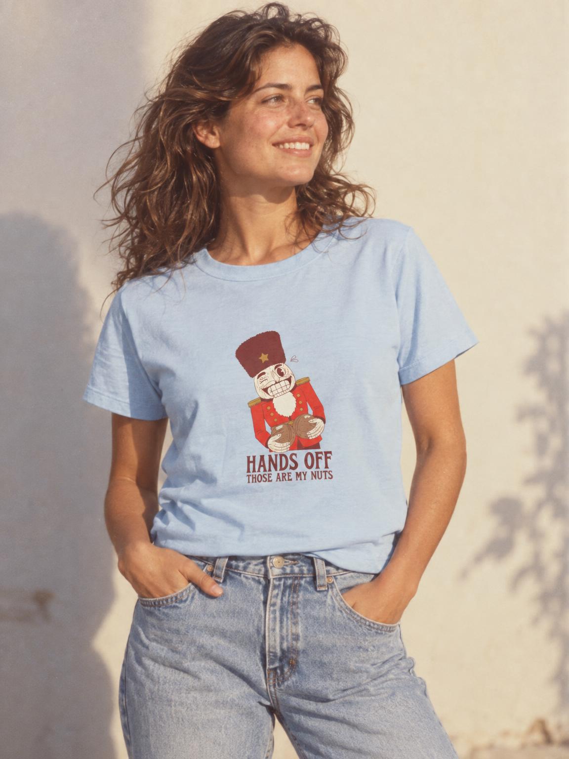 Funny Christmas Nutcracker Hands Off My Nuts T-Shirt in Light Blue – worn by a woman